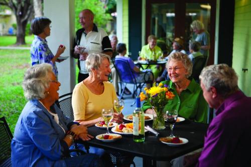 people eating and enjoying at dusk